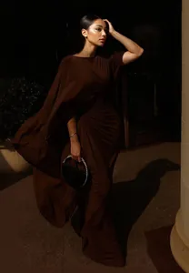 Elegant brown floor-length evening gown with a unique draped cape and slim-fit style.