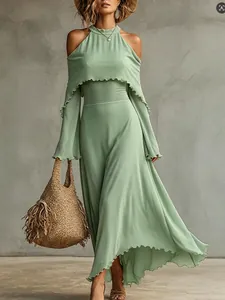 Elegant sage green cold-shoulder maxi dress with ruffled edges for a summer vacation look