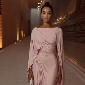 Elegant light pink evening gown featuring pleated waist and asymmetrical cape sleeves design