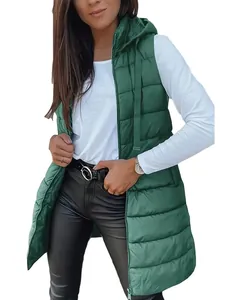 Close-up of a women's long forest green hooded quilted vest with functional zipper
