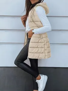 Full-length side view of a beige hooded puffer vest paired with black leather leggings.