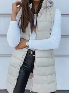 Detail view of women's long hooded puffer vest with zipper closure and solid light gray color