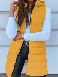 Detail view of mustard yellow quilted hooded vest with zipper closure for women