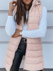 Close-up detail of women's long hooded quilted puffer vest in soft pink color