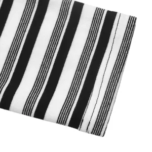 Close-up of black and white striped ribbed knit fabric with fine stitching detail