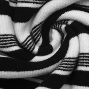 Macro view of soft black and white striped ribbed knit fabric for T-shirt dress