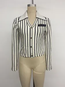 Detail view of a vertical striped knitted cardigan with a contrasting white collar
