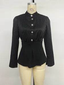 Detailed view of striped long-sleeved shirt with peplum waist and jeweled buttons