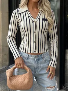 Detail view of a slim-fit navy and white striped knit cardigan with gold buttons