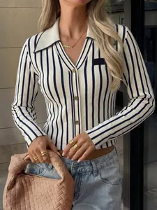 Detail view of an elegant slim-fit navy and white striped knit cardigan with gold buttons