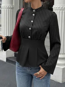 Detail view of black pinstriped blouse with silver buttons and elegant pleated peplum waist