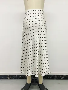 Elegant white high waist polka dot mermaid midi skirt shown on a mannequin form