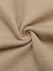 Macro view of high-quality soft camel knit fabric texture for women's pullover sweater