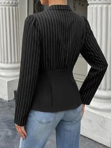 Back view of a chic pinstripe shirt with waist cinching patchwork detail for women