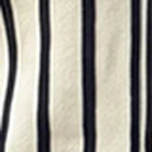 Detailed macro view of the black and white vertical stripe pattern on knit fabric texture