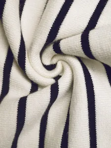 Detailed close-up of soft black and white striped knitted fabric texture