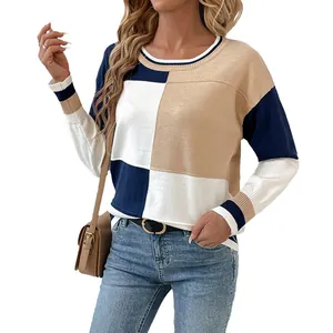 Women's stylish crewneck color block knit sweater with navy and tan patchwork.