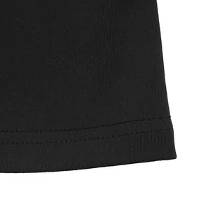 Macro view showing the high-quality double-stitching detail on the hem of a black shirt