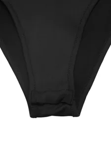 Close-up detail of the black sleeveless bodysuit crotch with precise stitching