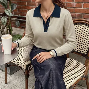 Beige long-sleeved knitted polo shirt with navy contrast collar and cuffs for women
