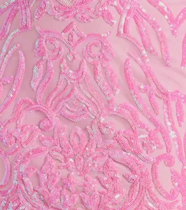 Close-up macro detail of pink sequins on sheer mesh fabric for an elegant evening dress