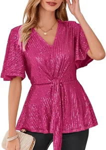 Close-up detail of fuchsia sequined V-neck top with flutter sleeves and tie-waist