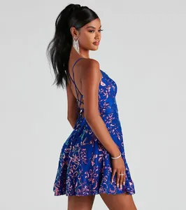 Detailed side view of a shimmering blue sequin cocktail dress featuring an open cross-back