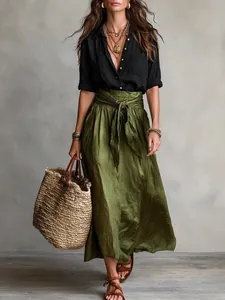 Boho chic two-piece set featuring black linen shirt and olive green maxi skirt outfit