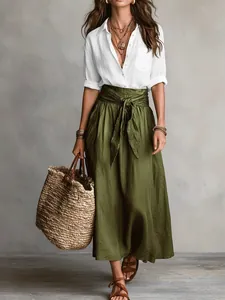 Full view of women's casual two-piece set featuring a white shirt and green maxi skirt