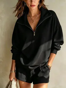 Casual women's black half-zip ribbed long sleeve pullover with matching shorts set