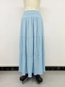 Detailed view of light blue high waist tiered maxi skirt with elastic waistband.