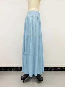Full vertical view of a light blue smocked tiered maxi skirt displayed on a mannequin