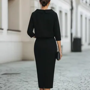 Elegant black two-piece set with long-sleeved top and pencil skirt for urban commute.