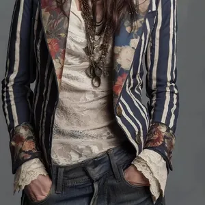 Detailed view of bohemian striped blazer featuring floral lapels and delicate lace cuffs.