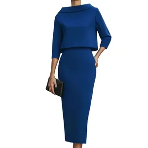 Elegant royal blue two-piece set with a wide collar top and a slimming midi pencil skirt