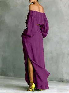Back view of elegant purple two-piece set with off-shoulder top and slit maxi skirt