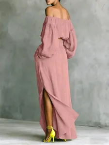 Back view of pink off-shoulder two-piece set with lantern sleeves and long slit skirt
