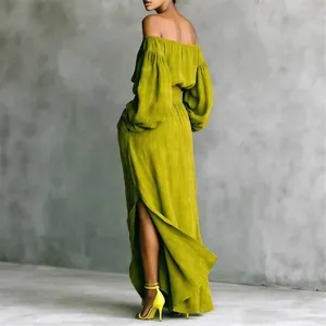 Elegant olive green two-piece set featuring an off-shoulder top and a high-slit maxi skirt.