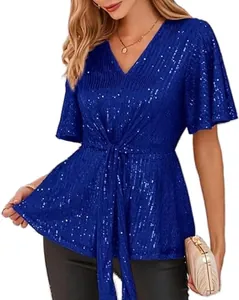 Detail view of a sparkling blue sequin V-neck top with elegant bell sleeves and waist tie