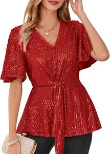 Close-up of red sparkling sequin top with V-neck and elegant flare sleeves detail