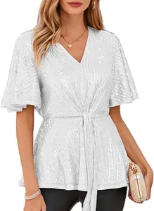 Close-up detail of white sequined V-neck top with elegant flare sleeves for parties.