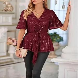 Elegant burgundy sequined top detail showing flare sleeves and cinched tie waist