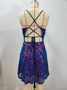 Detailed back view of a sparkling blue sequin mini cocktail dress with criss-cross straps