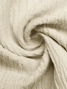Detailed macro shot of textured beige fabric for summer high-waist A-line maxi skirts