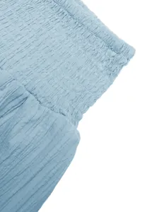 Detailed view of light blue smocked elastic high waist long skirt with fabric texture