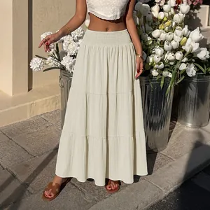 Elegant high waisted smocked tiered maxi skirt in cream, perfect for casual summer outings
