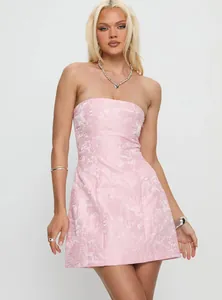 Close-up detail of a pink floral jacquard strapless mini dress for women's fashion