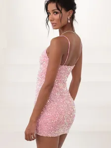 Detailed side view of a sparkling pink sequin bodycon mini dress with thin straps