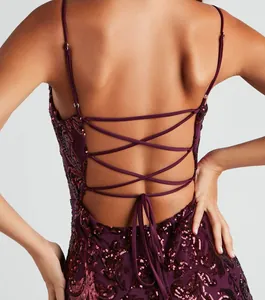 Close-up of an elegant burgundy sequin party dress featuring a strappy lace-up back design