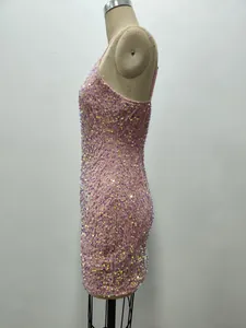Side view detail showing the intricate pink sequin texture on velvet mini dress.